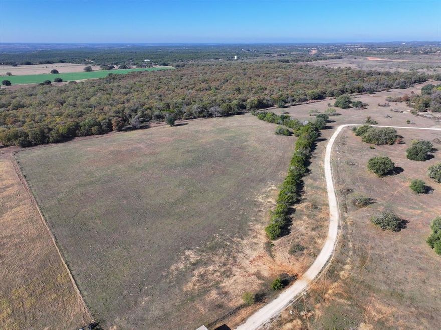 Bring your vision to life on this 11-acre tract located in the desirable Glen Rose school district.  Chose the country living lifestyle, and enjoy this peaceful rural setting with plenty of room for a custom home, livestock, or recreational use. Mature trees and open pasture provide versatility and privacy. Conveniently situated with easy access to shopping and entertainment amenities available in both Glen Rose or Granbury and it's an easy commute to the DFW Metroplex via the Chisholm Trail  Located at the end of a private road ensuring privacy and security, this property has so much to offer.  Property will be restricted to  residential, or farm and ranch use, no mobile or manufactured homes allowed on the property, no commercial or industrial business activity and live oak trees can not be removed.  Property will will require a well and septic. Seller or listing agent must be present to show proposed property lines, so confirmed appointments will be required.  Access will be granted with a dedicated easement.