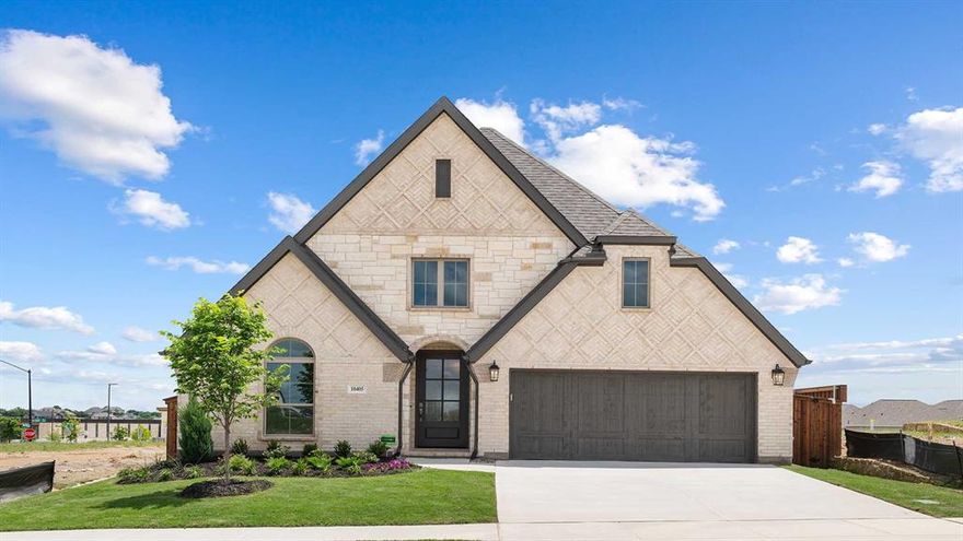 Extended entry with 13-foot ceiling leads to open kitchen, dining area and family room. Kitchen offers generous counter space, corner walk-in pantry and inviting island with built-in seating space. Dining area flows into family room with a wood mantel fireplace and wall of windows. Game room with French doors just across from kitchen. Primary suite includes double-door entry to primary bath with dual vanities, garden tub, separate glass-enclosed shower and two large walk-in closets. Secondary bedrooms feature walk-in closets. Covered backyard patio. Mud room off two-car garage.