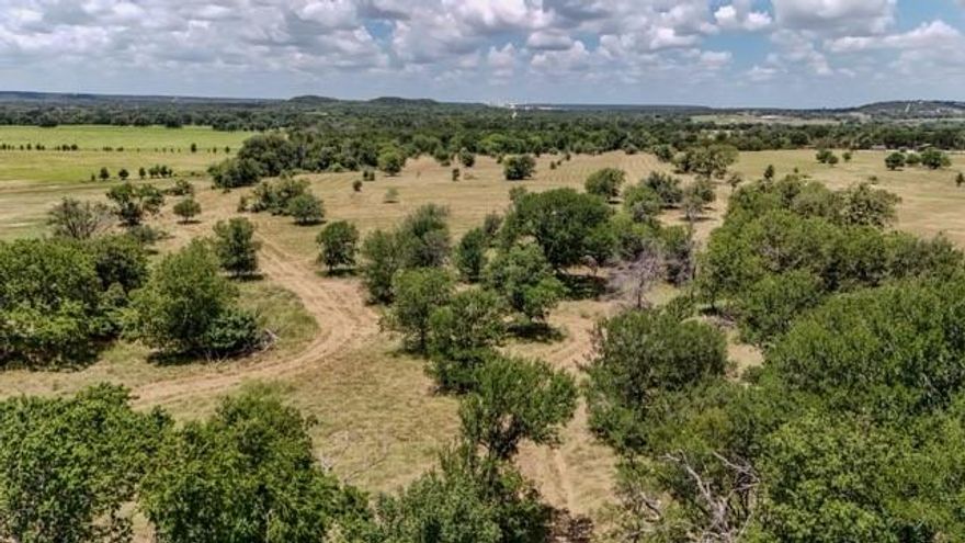 Welcome to your own piece of TX paradise! This stunning 60-ac property, nestled along the Bosque River just outside Valley Mills, TX, offers a rare oppty to embrace the tranquility of country living while being a mere 30 min away from the vibrant city of Waco. As you enter the property you'll be captivated by the gentle rolling terrain adorned with scattered oak trees, creating a scenic & peaceful landscape. The land is a canvas for your dreams, whether you envision building your dream home or a private ranch. Situated on a quiet county road, this property provides a serene escape from the hustle & bustle of city life. The area is characterized by its natural beauty, offering a perfect blend of privacy & accessibility. One of the key features of this property is its proximity to the Bosque River, inviting you to indulge in a variety of recreational activities. Don't miss the chance to own this 60-ac gem on the Bosque River. Seller to contribute $50K towards water well at closing.