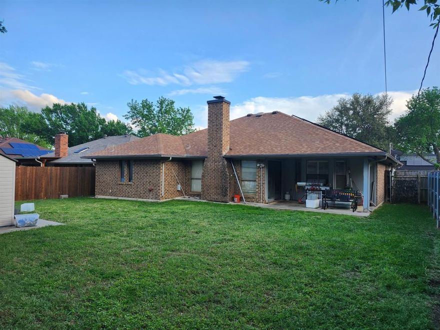 This 3 bedroom single-story property offers a flexible layout with multiple living areas, giving you room to relax, entertain, or create a home office setup that fits your lifestyle.

The main living room features vaulted ceilings and a cozy brick fireplace, creating a warm and inviting focal point. The kitchen offers ample cabinet space and a functional layout, ready for your personal updates and style.

Bedrooms are generously sized, providing comfort and flexibility for family, guests, or hobbies. The layout allows you to move in and make improvements at your own pace while building equity over time.

Step outside to a spacious backyard with mature trees and a storage shed, perfect for outdoor gatherings, pets, or simply enjoying your own private space. The home also includes solar panels, offering potential energy efficiency and savings.

Additional features include an attached garage, dedicated laundry area, and a location close to shopping, dining, schools, and major highways for an easy commute across DFW.