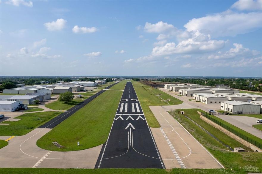 9400 Ragwing: THE LAST HANGAR LOT WITH  *BRING YOUR OWN BUILDER RIGHTS*  FOR SALE AT  T31 AERO COUNTRY AIRPORT EAST.  ****OWN THE LAND. NO GROUND LEASE!*** New hangar & residential development at Aero Country East.  T31 a privately owned, public use airport located between Frisco, McKinney & Prosper, in the North Dallas Texas Metroplex. Gated, luxury hangar & residential airport ~ airpark, with community pool and amenities for the exlusive use of Owners & guests.

• Paved & lighted, 3,100' runway & 1,500' airstrip, continuous.

• Dedicated taxiways. 

• Build your 60' x 60' Hangar, with 54' Hangar Door.

• CORNER HANGAR LOT: Add rollup door for your Big Toys, RV's & Trailers. 

• Bring your builder or use one of our preferred builders. (Hangar not included.)

• Bring your planes, cars & toys, and join the Airpark Lifestyle! 

• Pilots Quarters & Residences, Allowed

• (No Homesteading tax break for aircraft hangars.)

• RETAIL OR COMMERCIAL BUSINESS USE, STRICTLY PROHIBITED.

• NO FLIGHT SCHOOLS.

• Roadways, taxiways, runways & airstrip, completed.

• Underground Utilities, installed.

• City Water & City Sewer, CoServ Natural Gas & Electric Co-Op, AT&T Fiber Optic Internet, Cable & Phone.

Come be a part of an amzaing aviation community of Aero Country East. Schedule your tour. Please note this is a Gated Airport Community. No unauthorized vehicles. Showing appointment required.