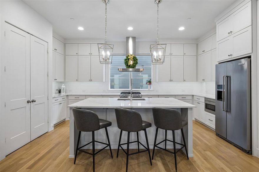 Beautifully built by luxury builder Olerio Homes in 2020, this modern transitional condominium offers a low-maintenance lifestyle in one of Dallas’ most convenient, central locations, with great proximity to The Medical District and Love Field. Very tall ceilings and recessed lighting carry throughout, creating an open feel with lots of natural light in the main living areas, while ceiling fans in both bedrooms and the living area add comfort. The layout is both functional and flexible, featuring a welcoming entry and a first-floor space ideal for a home office, second living area, or workout room. The main living area features light hardwood floors and an open-concept design that connects the kitchen, dining, and living spaces. The kitchen features white quartz countertops, crisp cabinetry, stylish open-frame geometric lantern pendants, and ample counter space, along with stainless steel appliances, including a KitchenAid refrigerator and a gas range. The powder bath is conveniently located near the living areas.  The primary suite, just under 300 square feet, features a large walk-in shower, double sinks, a generous vanity, and a spacious walk-in closet with built-in organization. The secondary bedroom includes its own en suite bath with a bathtub and a nicely sized closet. A centrally located third-floor utility room with built-in cabinetry adds everyday convenience. Additional highlights include an oversized 27-foot-deep garage and a private backyard with garden borders and an 8-foot wood fence, offering a low-maintenance outdoor space for relaxing or casual entertaining.
Just minutes from UT Southwestern Medical Center, Parkland Hospital, and Children’s Medical Center, with easy access to the Dallas North Tollway, I-35, Uptown, Downtown, Bishop Arts, and Highland Park Village. Google Nest home system and cameras will convey