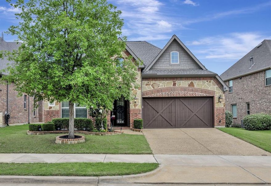 Luxurious one story home in the desirable Abbey Moor neighborhood in Trophy Club! A fantastic floor plan for down sizers, or young families - 3 bedrooms + 3 full baths + office + formal dining, or flex space. Gorgeous amenities abound from the custom iron front door to the engineered wood floors, and the floor to ceiling stone fireplace in the living room. French doors open to a spacious office. The gourmet kitchen features granite countertops, wood cabinetry and vent hood, stainless steel appliances, including a 5 burner gas cooktop and convection double ovens. The primary bedroom has an elevated ceiling adorned with crown molding, and a ceiling fan. The primary bathroom features a lighted mirror, jetted tub, separate vanities, separate shower, and a walk-in closet. New roof in 2024. New tankless water heater in 2023. Floored attic space with shelving for additional storage. A painted floor and mounted storage shelves in the garage. Beautiful curb appeal with a newly painted cedar garage door, and a beautiful magnolia tree. Minutes from exceptional Beck Elementary, Medlin Middle School, and Byron Nelson High School. Also near Trophy Club Pool, ball fields, dog park, paved jogging path, and Trophy Club Park with Grapevine Lake access! Great 1.751% tax rate. The PID has been paid off! Don't miss this desirable floor plan in a fantastic location!
