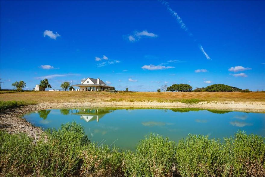 Stunning 256 acre ranch north of Cranfills Gap, with land in both Bosque and Hamilton counties. Gorgeous custom home with jaw dropping views, approx. 2000 ft. of both sides of North Prong of Meridian Creek, multiple ponds, several outbuildings. Home has open living area with three bedrooms, three baths, separate laundry room, second living area upstairs, and completely secure safe room or tornado shelter with access from inside the home.  The home has foam insulation, on demand water heater, oversize garage. There are covered porches on three sides with a firepit and hot tub overlooking a large pond and views of surrounding ranches. Other amenities include a nice shop, large equipment shed for tractors, trailers, and a separate cover for tractors or lawn equipment. There is a cool vintage barn, and cattle pens. The land has rolling terrain,easy areas to cross Meridian Creek, mixture of oaks and cedars, four ponds with varying amounts of water. Home and yard are fenced from the pasture.
