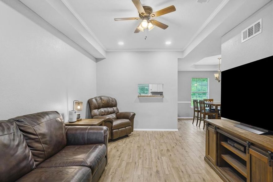 Welcome home to this move in ready gem nestled in the heart of Tiger Country!! Located in an established neighborhood with well maintained roads and bordered on two sides by a peaceful greenbelt. This adorable brick home offers the perfect lend of comfort, charm and convenience. Step inside to discover beautiful luxury vinyl plank flooring and a cozy galley style kitchen with a window to the family room. Oversized rooms, walk in closets and laundry room, trey ceilings, recessed lighting and ceiling fans are just a few of the amenities that stand out. The home features a spacious third bedroom thanks to a well done, permitted garage conversion. Offering flexibility for guests, a home office, playroom or home office space. Enjoy year round worry free comfort with your new HVAC system which was replaced in 2022.  Entertain with ease in the large fenced backyard with a covered patio and 6x8 shed, perfect for additional storage or a workshop. Freshly painted with warm, inviting interior paint colors, this home is full of character and functionality. Whether you are starting out or looking to downsize, this well-maintained property provides the ideal setting to live the good life in small town east Texas. Don't miss this opportunity for a solid investment. All window treatments and the shed convey with the property. Furniture is negotiable.