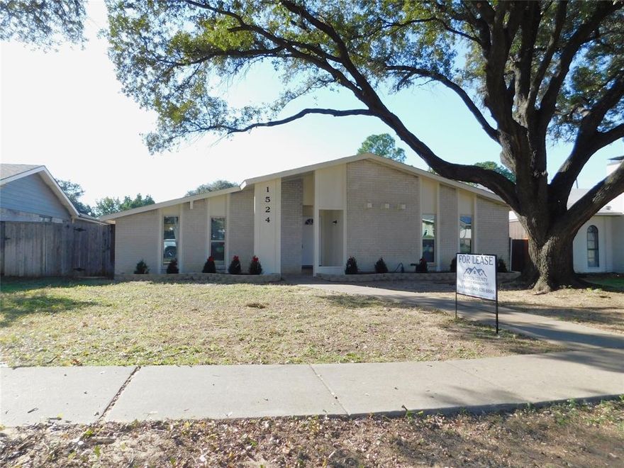 Recently remodeled three bedroom, two bath, one-story home on a tree-lined street in Lewisville. Formal living room and dining room off entry.  Kitchen includes granite counters and new, stainless steel appliances. Kitchen opens to additional living space that has a brick fireplace. Luxury vinyl plank flooring throughout. Property features vaulted ceilings, built in shelves and covered back patio. Easy access to I-35E and several shopping, dining and entertainment options close by. **New windows to be installed throughout in November 2025**