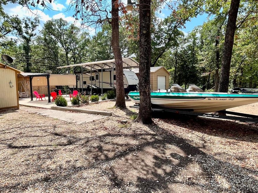 Price is amazing and the sky is the limit for this attractive property in Siesta Shores, a conveniently located Cedar Creek Lake Subdivision!  This property consists of 2 back-to-back lots, each facing an asphalt street; a covered RV parking-storage area with hook-ups and a large concrete patio for entertaining & relaxing; an all-purpose metal building with electricity and water to meet your storage and workshop needs, or perhaps in the future your weekend or full-time living space; and more!!!  You can comfortably walk to the lake from this property, and if you elect to be a member of the voluntary HOA, you can use the neighborhood boat ramp and recreation area.  Location near Gun Barrel City for all your dining, shopping and miscellaneous services is a a definite calling card.  The Dallas Metroplex can be reached from the area within an hour for substantial medical and employment needs.  Do not hesitate...view this versatile jewel today!