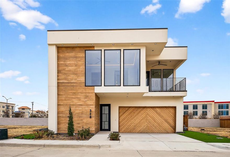 Stunning never-lived-in modern single-family home located in the highly sought-after Richardson ISD. This beautifully designed residence showcases warm wood accents that perfectly complement the clean, contemporary aesthetic. Step inside to find expansive large-format porcelain tile flooring, designer lighting throughout, and an open-concept layout ideal for both everyday living and entertaining. The gourmet kitchen is a true showpiece, featuring quartz countertops and a full quartz backsplash, gas cooktop, built-in oven and microwave, pot filler, and abundant cabinetry for storage. The spacious primary suite offers a serene retreat, while the thoughtfully designed floor plan provides both functionality and style. A well-appointed laundry room with built-in sink adds everyday convenience. Enjoy outdoor living at its finest with a fully equipped outdoor kitchen complete with a built-in gas grill—perfect for hosting gatherings year-round. This exceptional home combines modern elegance, quality craftsmanship, and prime location—an incredible opportunity not to be missed.