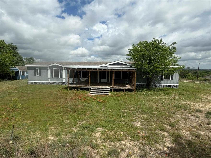 Big, beautiful home on a gorgeous, unique lot with only one close neighbor there is plenty of room for your family and livestock. 
This home features 4 bedrooms plus an office and 2 living spaces! Relax on the covered, private front porch for quiet country evenings with a great view! New 10x16 shed, fenced backyard, and plenty of trees!