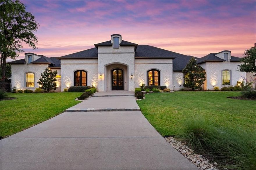 Located at the end of a peaceful cul-de-sac in Waco’s desirable Hidden Valley, this Loera-built custom home offers luxury, comfort, and functionality. A spacious foyer leads to an elegant formal dining room and a private home office with French doors, crown molding, and custom cabinetry. The showstopping kitchen centers around a grand Carrara marble island with two sinks and Thermador appliances, including a six-burner range with griddle and double ovens. The oversized walk-in pantry and open layout make entertaining effortless.  The isolated primary suite is a private retreat with a fireplace, barrel ceiling, surround sound, and patio access. The spa-inspired bath features a soaking tub, dual-entry walk-in shower, his-and-her vanities, a makeup bar, and a vast custom closet.  Bedrooms 2–4 are on the opposite wing. One serves as a guest suite with a full bath and walk-in closet. Bedrooms 3 and 4 share a Jack-and-Jill bath, both large enough for king beds or twin setups. A second living area overlooks the pool and includes a built-in bar—ideal for hosting. Other highlights include a guest half bath, utility room with sink and stone countertops, and a 3-car garage with poly-coated floors, cabinetry, storage closet, and attic access.  Step outside to a covered patio with remote-controlled screens, full outdoor kitchen, fireplace, gunite pool, and attached spa—surrounded by lush landscaping and privacy.  Additional amenities include a Control4 whole-home audio system, security system, custom landscape lighting, full sprinkler system, smart home features, exceptional storage, and an oversized lot. Located in Midway ISD (South Bosque Elementary and River Valley Middle School). This exceptional property offers an unmatched blend of craftsmanship, comfort, and privacy—designed for those who value both elegance and ease of everyday living.