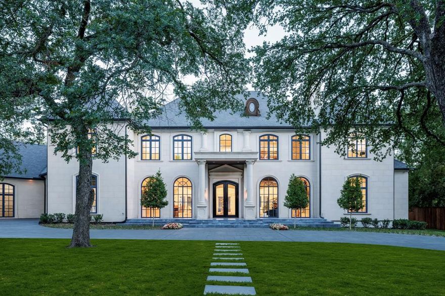 Nestled behind private iron gates, this extraordinary estate is situated on over an acre in the prestigious heart of Old Preston Hollow.
This meticulously reimagined French Renaissance-inspired residence spans nearly 14,922 square feet and offers unparalleled privacy and elegance. Featuring 7 spacious bedrooms and 9 full and 2 half baths, the home showcases exquisite craftsmanship, luxurious materials, and timeless finishes throughout. Upon entry, a grand foyer with rich moldings sets the tone for the sophisticated interiors. The main-level primary suite is a true retreat, boasting separate his-and-her baths with marble floors, individual dressing areas, a double shower, and a private sitting room overlooking the resort-style backyard with pool and cabana. Upstairs, four generously sized guest suites each offer private, spa-like bathrooms. Additional amenities include a gourmet chef’s kitchen, a fully equipped fitness room, and an attached oversized apartment ideal for guests or staff. Car enthusiasts will appreciate the five garage spaces, while the beautifully landscaped grounds—with a sparkling pool, elegant cabana, and lush gardens—create a serene, resort-like ambiance.