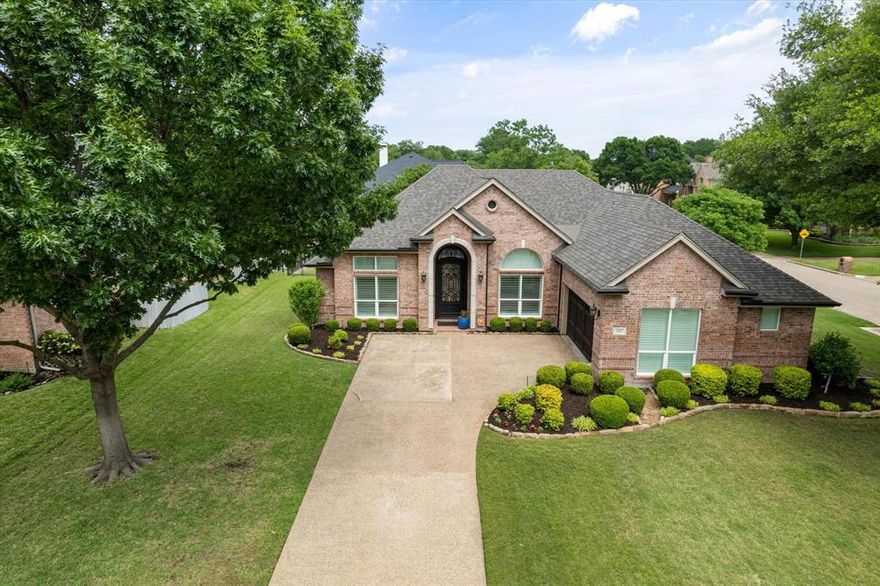 This meticulously maintained one story home is on a spacious corner lot on the second hole of the Walnut Creek Country Club. The home has been updated and offers plenty of natural light, including triple sliding glass doors with views of the golf course. The home features a large, beautiful steel door, and wood floors throughout the open concept kitchen and living area, which has a gas fireplace. The den, with built-in cabinets and French doors, offers office space for two, and is opposite the media, dining room. The kitchen has a breakfast nook, an oversized island which is ideal for entertaining, granite countertops, roll-out pantry drawers, stainless steel appliances, including a chef’s 48 inch six burner gas pro range with griddle, and a built-in bar fridge. A covered patio overlooks the beautiful pool and spa. The primary suite, split from the other 3 bedrooms, has a sitting area, workout space and a door for access to the pool. The gorgeous primary bathroom offers custom cabinetry, beautiful lighting, and a pull out hamper. The utility room features a marble floor and custom cabinets to the ceiling. All in a highly desirable neighborhood zoned for Mansfield High School and easy access to the Country Club.
