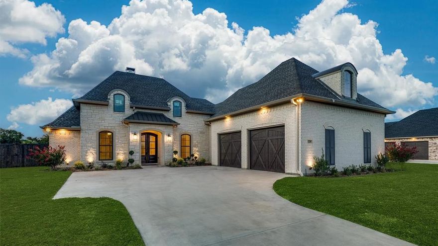 Discover this elegant Modern Farmhouse offering exceptional design, comfort, and natural scenery. The gourmet kitchen showcases built-in cabinets, dual sinks, granite countertops, a spacious island, walk-in pantry, and an inviting eat-in layout. The primary suite is a serene retreat with custom built-ins, ceiling fan, custom closet system, dual primary baths, dual sinks, garden tub, separate shower, and a large walk-in closet. An open-concept great room and family room connect seamlessly to the kitchen and dining area, centered around a beautiful raised-hearth wood-burning fireplace with gas starter and a stylish dry bar. Quality carpet in bedrooms and ceramic tile and wood flooring throughout the home elevate the aesthetic. A large study with abundant natural light and floor outlets provides ideal workspace flexibility. The spacious private backyard backs to a peaceful pond with a water feature and a wooded creek, creating a truly tranquil setting. Don’t miss this rare opportunity—schedule your private viewing today.