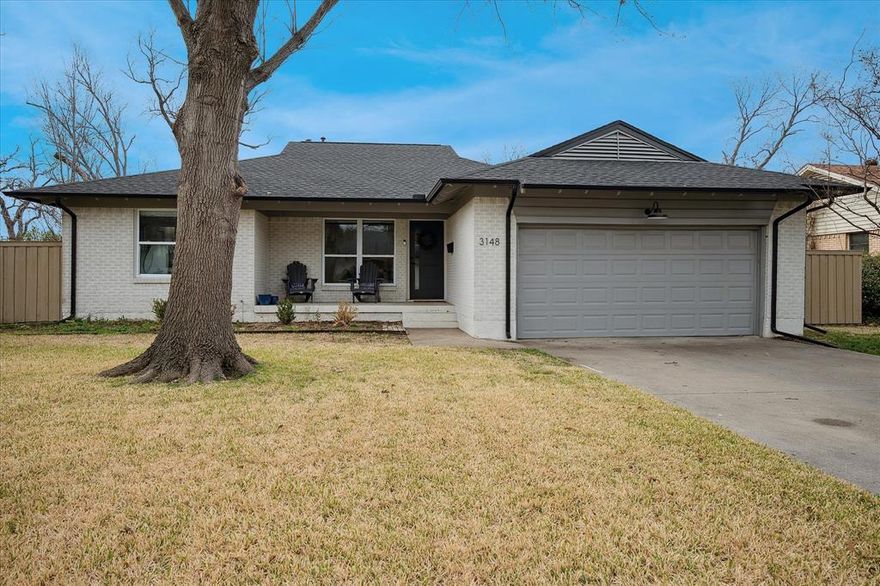 Open-concept floor plan features light oak hardwoods and abundant natural light throughout. The kitchen is designed for both everyday living and entertaining, with custom cabinetry, a large center island, and Kitchenaid appliances including a gas range. The primary bath offers a deep soaking tub, custom vanity, and a walk-in in shower with custom glass enclosure. Designer light fixtures and recessed lighting enhance the interior spaces. Significant upgrades include PVC plumbing underneath the home, roof with ridge-vent and gutters in 2023. The oversized backyard is enclosed by board-on-board, stained and sealed cedar fence - ideal for privacy, outdoor entertainment and pets! Excellent curb appeal completes this move-in ready home!