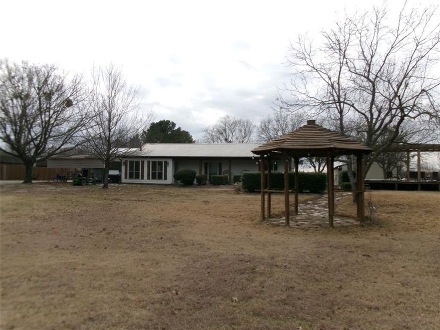 0% Down Payment Program Available For This Home!! Ideal Location With No HOA To Deal With At All. Schools And shopping Close For The Whole Family.  3Bedroom 2Bath Country Home For The Kiddos To Raise Animals Like Horses, Cows And Chickens To Name A Few. This Has A Pool ,Pergola And Deck For Entertaining Your Guests And Family. If You Have A Growing Family That Needs A Place To Stay For A Short Time  A Barndo Mother In Law Guest Suite With 2Bedrooms And 1 Full Bathroom Is Included. What A Great Value With This Mini Ranch Home A Total Of  5Bedrooms and 3Full Baths Is a Great Bargain. Did I Mention There are Some Corrals, Sheds, Chicken Coop, Barn, Stables And Storage Area. There Is Cross Fence And Pipe For Security In Back Pasture And Front Pasture For Your Pets To Roam. Hurry On By Before This One Is Gone!