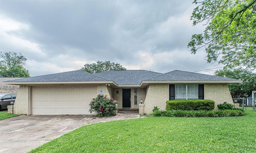 Nestled at the end of an established cul-de-sac in Fort Worth, this classic move in ready home features a functional 3-bedroom, 2-bathroom floor plan.
The interior features high beam celings with a stunning brick firelace and solid built-ins in the living room. Durable and timeless, the abundance of kitchen cabinetry provides ample stoarge space for all your culinary essentials. A dedicated dining area sits adjacent to the kitchen, making mealtime a breeze. The generous sized bedrooms includes a primary ensuite bathroom with dual sinks and seperate powder station or vanity area. Step outside to discover a covered back porch providing the perfect shaded retreat for outdoor dining or relaxing while overlooking the vast green space—ideal for pets, or play. This home is conveniently located with easy access to local Fort Worth amenities, shopping, and dining. Schedule your showing today and see the potential this charming home has to offer!     Roof -2019, HVAC-2019 and water heater-2018.
