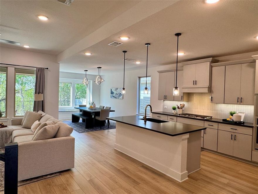 Some homes are built. This one was curated — and it shows the moment you walk through the door.

Nestled on a lush greenbelt lot in sought-after Painted Tree, this east-facing home feels better than new, with thoughtful upgrades around every corner. A private office with glass French doors sets the tone. The living room glows with flush-mount LED lighting, flowing seamlessly into a stunning open-concept kitchen featuring marble-look quartz countertops, upgraded cabinetry, champagne bronze fixtures, a large granite composite single-bowl sink, a 5-burner gas cooktop under a Cambridge Wood Hood, and a charming box window in the dining nook. Downstairs also includes a half bath, laundry room, and built-in cubbies right off the garage — because everyday life should be effortless.

The primary suite is your escape — bay window, spa-like bath with a large walk-in shower, double sinks, and a walk-in closet that won't disappoint.

Head upstairs to a massive game room, an oversized media room pre-wired for 5.1 surround sound and flat-screen viewing, and three generous bedrooms, each with a walk-in closet — one complete with its own ensuite. The second full bath features double sinks and a private water closet.

Out back, a covered patio with a gas stub overlooks serene green space through a wrought iron fence — your blank canvas for outdoor living. The 2-car garage is EV-ready, and front uplights plus holiday-light outlets in the eaves make this home shine year-round.

8-foot interior doors. East-facing light. Greenbelt privacy.

Come see it — you won't want to leave.
Ask about the exclusive lender incentive offered, a 1-0 buydown paid by lender