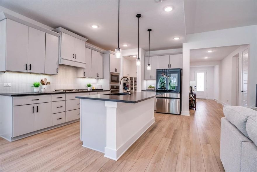 Some homes are built. This one was curated — and it shows the moment you walk through the door.

Nestled on a lush greenbelt lot in sought-after Painted Tree, this east-facing home feels better than new, with thoughtful upgrades around every corner. A private office with glass French doors sets the tone. The living room glows with flush-mount LED lighting, flowing seamlessly into a stunning open-concept kitchen featuring marble-look quartz countertops, upgraded cabinetry, champagne bronze fixtures, a large granite composite single-bowl sink, a 5-burner gas cooktop under a Cambridge Wood Hood, and a charming box window in the dining nook. Downstairs also includes a half bath, laundry room, and built-in cubbies right off the garage — because everyday life should be effortless.

The primary suite is your escape — bay window, spa-like bath with a large walk-in shower, double sinks, and a walk-in closet that won't disappoint.

Head upstairs to a massive game room, an oversized media room pre-wired for 5.1 surround sound and flat-screen viewing, and three generous bedrooms, each with a walk-in closet — one complete with its own ensuite. The second full bath features double sinks and a private water closet.

Out back, a covered patio with a gas stub overlooks serene green space through a wrought iron fence — your blank canvas for outdoor living. The 2-car garage is EV-ready, and front uplights plus holiday-light outlets in the eaves make this home shine year-round.

8-foot interior doors. East-facing light. Greenbelt privacy.

Come see it — you won't want to leave.
Ask about the exclusive lender incentive offered, a 1-0 buydown paid by lender