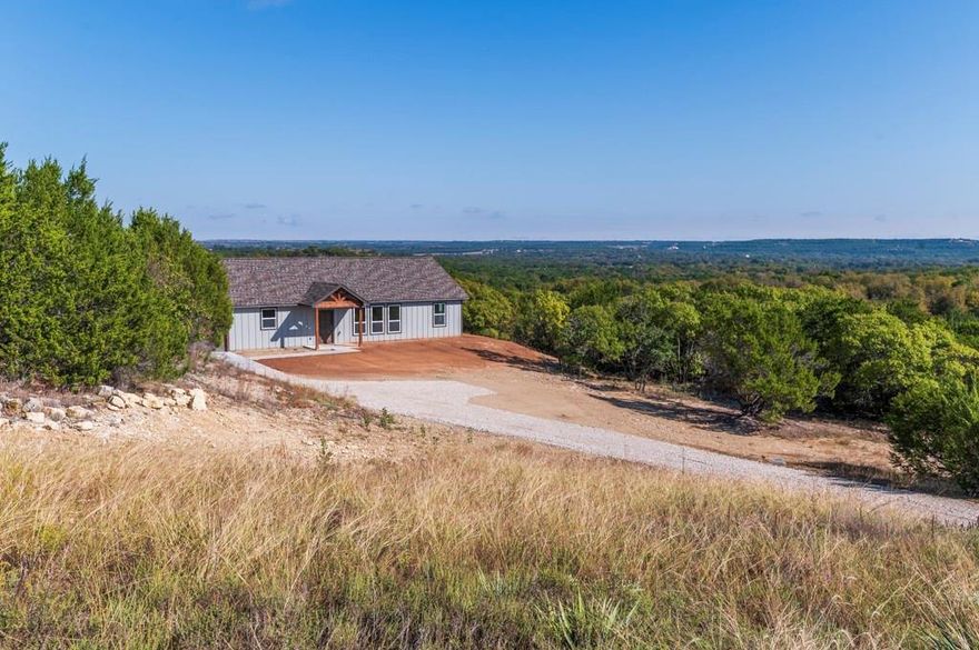 Come enjoy peaceful country living in this beautiful new construction home located in the Mountain Lakes addition of Bluff Dale, TX. Sitting on a full acre, this 3-bedroom, 2-bath home offers plenty of space, privacy, and stunning views of the rolling hills. Inside, you’ll love the open floor plan that makes it easy to gather with family and friends. The kitchen features quartz countertops, stainless appliances, a big island, and a spacious pantry, perfect for cooking and entertaining. The luxury vinyl flooring adds style and durability throughout, and each bedroom comes with nice-sized closets for plenty of storage. Step outside and enjoy the quiet surroundings and large yard, giving you room to relax, garden, or play. With an attached garage and a peaceful, secluded lot, this home offers both comfort and convenience in a beautiful country setting. Mountain Lakes offers 2 community lakes for fishing and boating, a clubhouse, an RV park and storage, a large community pool, a lakeside park and even a community garden. Must See!