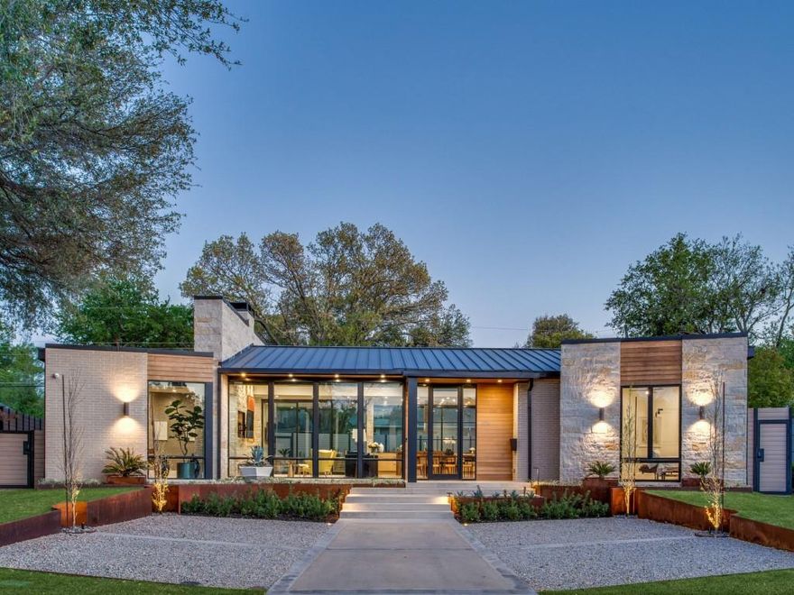 Modern masterpiece in the heart of Devonshire. Built in 2020, this home features high-end luxury design and custom details including custom dry stacked stone, custom metal gutters, metal roof, Flush mounted exterior and interior speakers, piered beam post tension slab foundation, Smooth cedar overhang and exterior ceilings, All 2 x 6 exterior walls with foam insulation, including roof. Isokern fireplace with gas starter, Western Architectural Aluminum Doors, Authentic Trestlewood ceiling beams, Custom full overlay rift cut cabinets in kitchen, Wolf and subzero appliances, 2 wine fridges, 2 Trane HVACs, 9” wide oak hardwood floors, Custom cabinets, Neolith countertops in kitchen, marble tops in bath, Custom antique limestone mantle with tv niche on stone wall, Tankless water heater with circulating pump, Custom landscape with firepit and front parking area for 4 cars.  Floor to ceiling glass windows with electric privacy shades and dreamy oversized lot. Welcome Home!