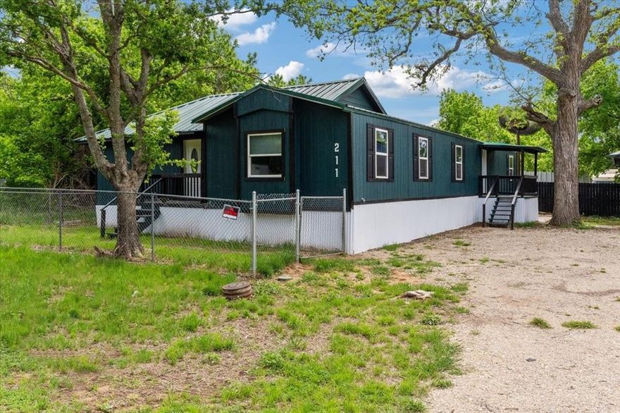 Complete transformation with thoughtful additions — this is not your typical mobile home. Although currently configured as one home conveniently divided into two separate living spaces, it can easily be converted back to a traditional single-family layout if desired.
In its current setup, go ahead and count everything twice: two front doors, two back doors, two living areas, two kitchens, two full bathrooms, two laundry areas, all topped off with 5 total bedrooms. This unique arrangement offers incredible flexibility for multigenerational living, rental income, or a spacious single-family residence.
Beyond the versatile floorplan, everything is brand new. Updates include new flooring, walls, interior and exterior paint, electrical, plumbing, water heaters, cabinets, hardware, siding, shutters — and the best upgrade of all: a brand-new 45-year metal roof!!
A truly move-in-ready property with endless possibilities.