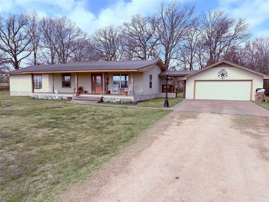 Refined country living just minutes from downtown Winnsboro. This four bedroom, two bath neat-as-a-pin home is move-in ready, and beautifully updated with new vinyl plank flooring throughout. The custom kitchen features handcrafted cabinetry and opens seamlessly to expansive living and dining spaces, perfect for entertaining. Two bedrooms offer private ensuites, while the primary suite showcases a walk-in closet and a custom designed bath. Enjoy quiet mornings and relaxing evenings on both covered porches, surrounded by just over four acres of pristine East Texas land. Complete with a two car garage, metalwork shed, and private well, this property delivers space, style, and serenity.