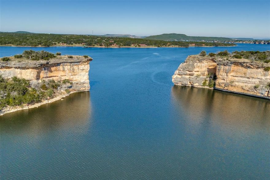1102 Hill Top Point – Sportsman’s World, Possum Kingdom Lake
Five private acres just off Hells Gate Drive! This stunning property captures sweeping views of Hells Gate—the most iconic landmark on Possum Kingdom Lake. From your own private vantage point, enjoy the legendary Hells Gate fireworks shows without ever leaving home.

Featuring a private road, concrete slab, and utilities in place, this homesite is ready for your custom lake retreat. Surrounded by nature and offering complete privacy, it’s the perfect blend of tranquility and luxury within the Sportsman’s World community, with access to the marina, pool, and tennis courts.

Own the view everyone dreams of and build your lake escape at 1102 Hill Top.