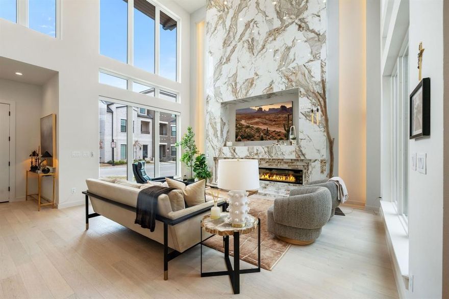 Welcome to the power move you didn't know you needed. This Perfectly positioned in the heart of Historic Downtown Oak Street, this architectural showpiece puts you steps from Roanoke's premier dining, wine bars, and entertainment yet feels like a private retreat curated for the ultra-discerning. Walk to dinner. Catch a show. Be home in minutes. And when its time to jet? DFW Airport is just a quick drive away. Lock, leave, and live large or settle in and stay awhile. This townhome is sophisticated without trying too hard. Clean lines. Thoughtful scale. Floor-to-ceiling windows flood the open-concept living space with natural light and frame serene views of your own private courtyard because yes, privacy and proximity can coexist. The first floor delivers a luxury masterclass: Expansive living area with a statement fireplace and custom built-ins
Designer dining space that flows effortlessly Chefs kitchen built for both performance and aesthetics, complete with a true working pantry
Spacious laundry room. Powder bath. Elevator access and floating staircase The first-floor primary suite is exactly where it should be private, sunlit, and serene. Oversized windows overlook the courtyard, creating a boutique-hotel vibe every single morning. The custom walk-in closet features built-ins and designer lighting. And the spa-inspired ensuite? Its next-level. Double vanities, elevated finishes, and a glass-enclosed wet room bathed in natural light designed to hold warmth and deliver that steam-and-reset energy without ever leaving home. Upstairs continues the flex: Spacious game room with windows overlooking the courtyard Powder bath Oversized secondary bedrooms, each with en suites Private balcony with artificial turf and built-in drainage system low maintenance esp .for the Fur Babies.  Second floor laundry room and walk in storage closet.  This home has it all...