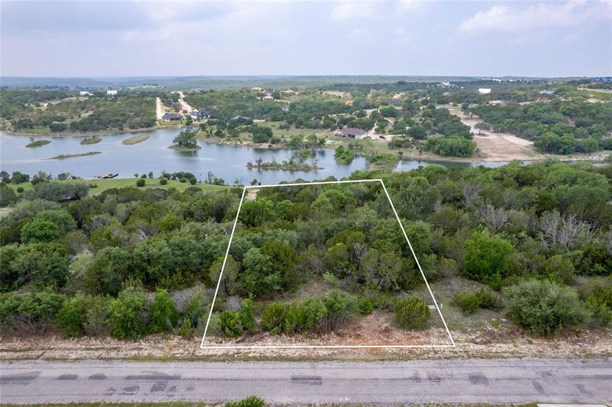 Waterfront property overlooking Anglers Cove Lake that is approx 45 acres, this 1+ acre parcel has water and electricity at the street, beach type waterfront on one side and deeper water on the other side of water frontage, this multi level lot is perfect for building street side, middle or lower level of this lot, the elevation changes show off the beautiful lake - build your home and enjoy the stunning views this property offers and take advantage of  the recreational opportunities with the two private lakes, community pool, club house, RV Park, and storage, along with a fantastic exercise park & pavilion. Bluff Dale, TX is located about one hour west of Fort Worth and convenient to Granbury, Glen Rose, Weatherford, and Stephenville.  Beat the city blues, come relax and enjoy the beautiful hill country that Bluff Dale Texas offers.