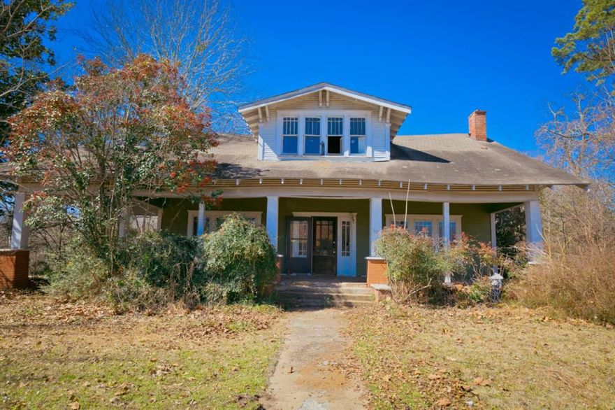 This charming home, built in 1912, is brimming with potential! If you're on the hunt for a one-of-a-kind fixer-upper in a quaint community with ample room to grow, inside and out, this is the perfect find. From the stunning craftsman-style trim to the original doors, windows, and floors, the craftsmanship throughout is truly remarkable. The abundance of shiplap adds even more character—this home is a treasure waiting for someone with an eye for old-world charm.

Nestled on 0.80 acres, the property includes a metal carport in the backyard. Plus, an additional 0.32-acre lot across O'Hara Street to the left of the home is also part of the deal, offering even more potential. Whether you’re looking to preserve its vintage charm or bring it back to life with restoration, a home like this doesn’t come around often.

The home is being sold as is. Did have gas heating, and window units are still present but unknown if they are working condition. The buyer and buyer’s agent are responsible for verifying all information.