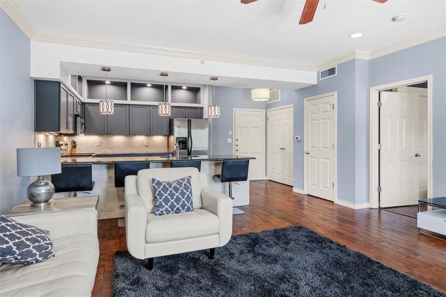 Experience stylish urban living in this beautifully renovated 1-bedroom, 1-bath condo in the heart of Dallas! Perfect for young professionals or those seeking a low-maintenance lifestyle, this top-floor unit blends comfort and sophistication with wood floors, granite countertops, and sleek under-cabinet lighting.

Located in a gated community, you’ll love the resort-style amenities including a sparkling pool, modern fitness center, and a lush courtyard with shaded lounging areas and an outdoor kitchen — ideal for entertaining or relaxing weekends at home. The unit features washer and dryer hookups, and with the right offer, furnishings, refrigerator, washer, and dryer can convey for a true move-in-ready experience. 

Some HOA amenities are as follows:  
Laundry facility, Fitness center, Private pool, Grilling stations, Designated pet area, Clubhouse available for reserved, private parties, Community business center in lobby with desktop for internet & printer access, Package delivery area in lobby for added security, 24-hour surveillance (51 cameras), Fob & code required for accessing property & premises, Covered parking in community garage on ground level, Parking spaces deeded with sale of unit (owners own their parking spaces), Premises maintained by porter service (3x per week), Property maintained by landscaping service (1x per week), Pool maintained by pool cleaning service, Property managed by on-site community manager (5 days per week), Limited concierge services offered by on-site manager, exterior insurance covered by HOA 

Whether you’re buying or leasing, this condo offers the perfect blend of convenience, comfort, location and city living — all just steps from Dallas' dining, shopping, nightlife and many colleges & universities including UT Southwestern Medical Center! 

**All information is deemed reliable, but buyer and buyer's agent to verify. Unit can be leased, fully furnished. Just contact one of the listing agents for details.**