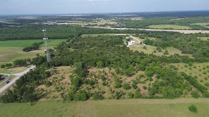 3.25 Acres outside city limits to enjoy some open space while still being close to I-45 for easy access North or South. Come enjoy these acres with plenty of tress and space between your neighbors. Seller will also consider building to suit. Hurry, this one will not last!!!