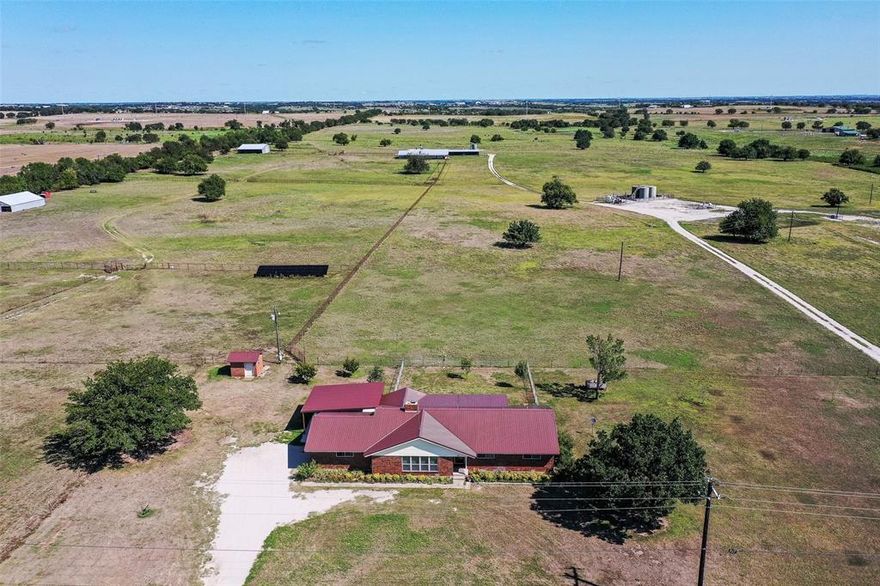 THIS EXCEPTIONAL PROPERTY WITH MANY IMPROVEMENTS IS LOCATED ON 173 ACRES JUST SOUTHEAST OF DECATUR WITH FM ROAD FRONTAGE ON FM 2264 ON THE SOUTH END AND COUNTY ROAD FRONTAGE ON CR 4010 ON THE NORTH END. THIS IS PRIME INVESTOR, DEVELOPER PROPERTY FOR MANY TYPES OF DEVELOPMENT BEING RESIDENTIAL, COMMERCIAL, HORSE PROPERTIES, RANCHING AND EVEN GAME PRESERVE CAPABILITIES! For DEVELOPERS it will certainly make a beautiful subdivision. The topography of it will allow for many homes, whether residential or small horse properties and a great setting of scenery. It has a main 2123 sq ft brick home with three-bedroom, 2 and a half bath residence, with energy-efficient solar panels, a metal roof, and a 24x30 attached carport. There is also a second home on the property that serves as a rental for investment income. It has its own septic system, water well, and in ground storm shelter. The solar panel system in place supports both homes. THE IMPROVEMENTS ARE MANY AND CAN ADD TO ANY DEVELPOPMENT OF ANY KIND. THERE ARE 4 LARGE BARNS AND OR SHEDS, ALSO WITH A DAIRY BARN WITH PIPE FENCED PENS AND CORRALS! NUMEROUS PIPE CROSS FENCES DIVIDE THE PROPERTY UP NICELY TO FIT YOUR NEEDS! THIS PROPERTY IS CERTAINLY PRICED TO SELL IN DECATUR'S GROWING AREA AND WITH ITS CLOSE PROXIMITY TO NOT ONLY DECATUR BUT ALSO THE NEARBY HIGHWAYS TO TAKE YOU TO THE DALLAS - FORT WORTH METROPLEX, AIRPORTS AND ALL AMENITIES YOUR LOCATION COULD NOT BE BETTER!! ALSO, THIS PROPERTY HAS BEEN USED FOR CATTLE FOR MANY YEARS AND IS CURRENTLY AG EXEMPT WHICH MAKES IT A MUCH BETTER DEAL!! CONSIDER IT TODAY!! SEE VIRTUAL TOUR LINK FOR AN AMAZING PROPERTY TOUR!!