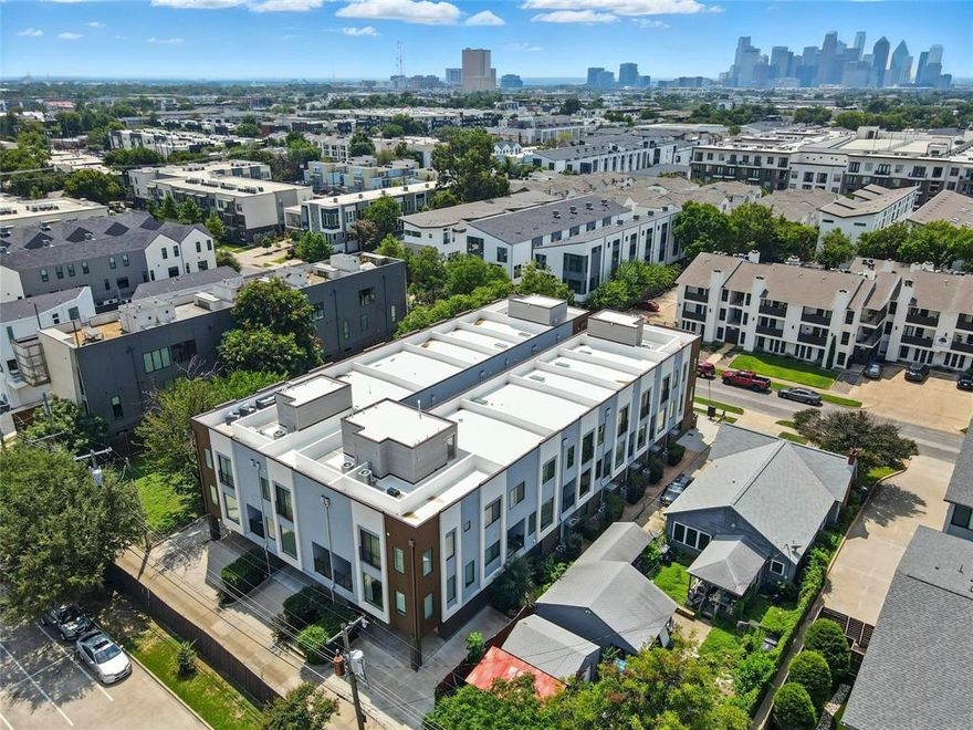 Experience sophisticated, upscale modern living in the heart of Dallas! This 4-story condo offers 1,996 sq. ft. of stylish, functional space with 2 bedrooms, 2.5 baths, and 2 flexible bonus rooms. The entry level features a versatile living area and a convenient half bath, perfect for a home office or guest space. The main level showcases an open-concept design with a spacious living room and private balcony, plus a chef’s kitchen complete with granite countertops, a large island, custom cabinetry, commercial-grade vented gas cooktop, built-in wine cooler, microwave, and walk-in pantry—ideal for both entertaining and everyday living. On the 3rd floor, the luxurious primary suite boasts a private balcony, spa-inspired bath with dual vanities, soaking tub with shower head, separate shower with body sprays, and a generous walk-in closet. A secondary bedroom with a full bath provides comfort for guests, family, or roommates. Additional features include wood flooring, decorative lighting, multiple staircases, and abundant natural light throughout. The private rooftop deck offers breathtaking city views, while the 2-car garage, tankless water heater, and low-maintenance lifestyle add convenience. Located minutes from Knox-Henderson, Uptown, and Downtown, this home combines modern design with unbeatable access to Dallas dining, shopping, and nightlife. Truly a must-see!