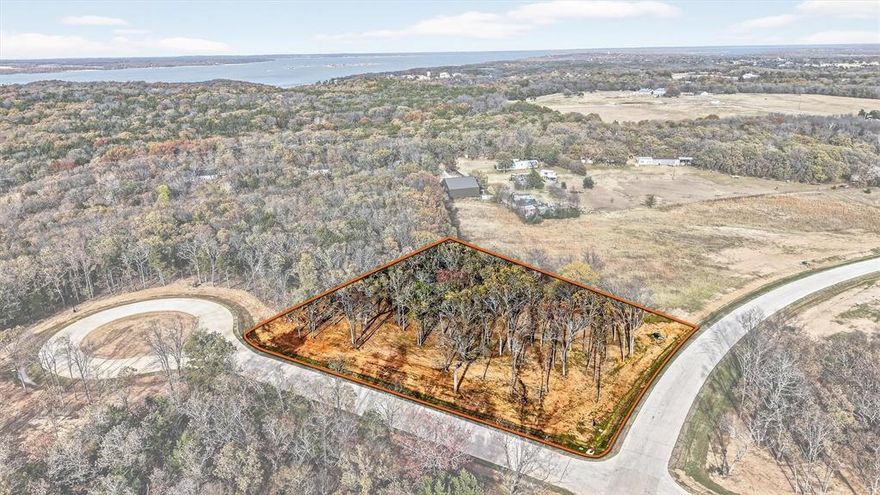 Lot 36 on White Tail Way offers a rare opportunity to secure a 1-acre corner lot in the prestigious, gated Spout Springs community. With added street presence and flexible design potential, this corner homesite provides an ideal setting for a custom home that stands out while still blending seamlessly with the natural beauty of the neighborhood.  Spout Springs features 84 estate-style lots thoughtfully designed to honor the land and provide privacy, peace of mind, and an elevated living experience. Located just minutes from Tanglewood Resort, Highport Marina, and Lake Texoma, residents enjoy easy access to golf, boating, dining, and resort-style recreation—all while returning home to the quiet elegance of a nature-forward community.  Lot 36 on White Tail Way combines the serenity of country-style living with the convenience of nearby shopping, dining, and entertainment. With limited availability in one of Grayson County’s most stunning gated neighborhoods, this corner lot represents an exceptional opportunity to build where nature meets sophistication and every detail has been carefully considered.