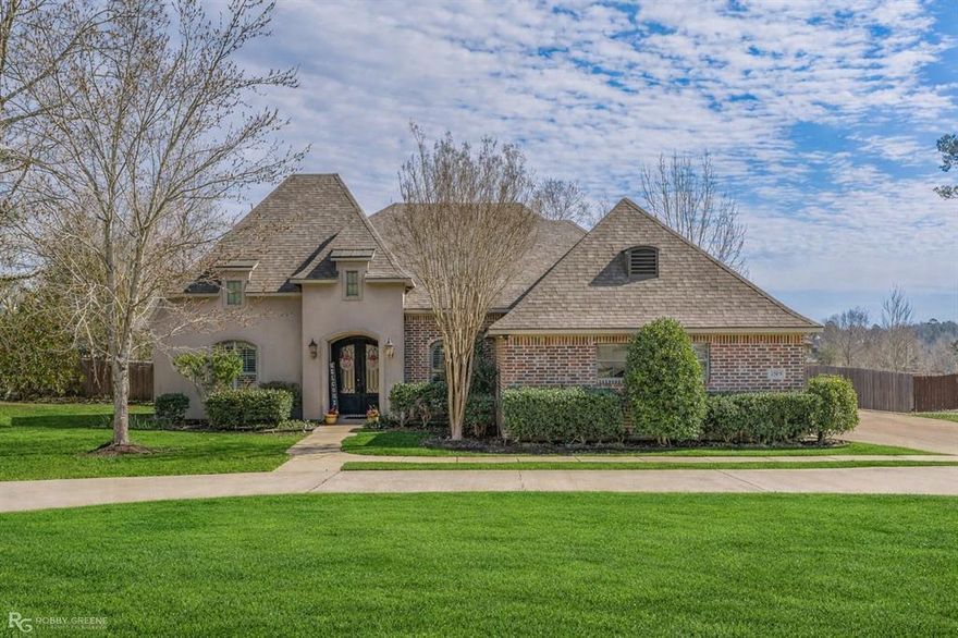 A beautiful custom-built residence tucked into one of Haughton’s most desirable neighborhoods, Forest Hills. Offering 4 bedrooms, 3.5 bathrooms, 2 living areas, an additional room for pool area or an office and 3,202 square feet, this thoughtfully designed home blends timeless elegance with everyday functionality. From the moment you enter the grand foyer, you’re greeted by architectural details that set this home apart, arched openings, stately columns, and soaring ceilings create a sense of refinement and space. The formal dining room provides an ideal setting for gatherings, while multiple living areas, including a welcoming living room and cozy hearth room, offer flexibility for entertaining or relaxing with family. The heart of the home is the spacious kitchen and breakfast area, featuring abundant cabinetry, generous counter space, and a layout designed for both hosting and daily life. Just off the main living areas is a sun-filled studio or flex space surrounded by windows, perfect for a craft room, art studio, home office, or peaceful retreat. Two bedrooms and a full bath are thoughtfully positioned to function as a private guest or mother-in-law suite, offering comfort and privacy for multigenerational living or visitors. The primary suite is a true sanctuary, boasting a tray ceiling, ample space, and a well-appointed en-suite bath. Step outside to your own backyard oasis. The in-ground pool is the centerpiece of a beautifully landscaped yard, complemented by two large patios ideal for entertaining, relaxing, or enjoying Louisiana evenings. A convenient halfbath with exterior access allows pool guests to stay outside, no wet footprints through the home. Additional highlights include a whole-home generator, ensuring peace of mind year-round, and a layout that truly “challenges comparison” with its blend of character, space, and versatility. This exceptional property offers comfort, quality, and lifestyle! REPAIRS AND INSPECTIONS ALL COMPLETE, READY TO CLOSE.