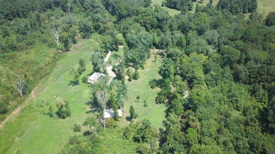 Don't miss this opportunity to own an exclusive home next to Lake Striker. This expansive 2.23-acre tract is an uncommon find, offering a substantial amount of space in a gorgeous, quiet, and serene corner of Rusk County.
The property features a charming and well-maintained 2,554 square foot rustic cedar home, ready for you to enjoy. The acreage is composed of 1.64 acres of deeded land, providing a solid foundation, plus a valuable 0.59-acre lease from the Lake Authority that extends your usable space. The grounds are beautifully shaded by mature trees, creating a private, country-style atmosphere—the perfect retreat for those seeking quality country charm and a genuine escape from the hustle and bustle.