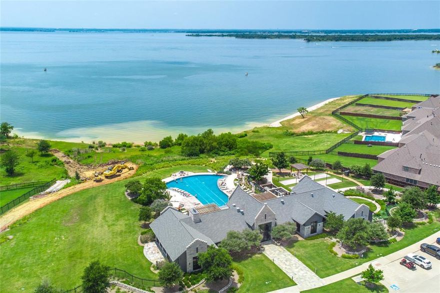 Stunning single-story home in Waterford Point, built in 2021, offering true resort-style living in one of The Tribute’s most desirable lakeside communities. Just moments from the community center, residents enjoy exceptional amenities including a private marina, beach access, and a resort-style pool.

This light-filled 3-bedroom, 2.5-bath home features an open and inviting layout with a bonus sunroom perfect for relaxing or entertaining. The modern kitchen is a showstopper with stainless steel appliances, a gas cooktop, and a spacious island ideal for casual breakfasts or hosting guests.

The private primary suite feels like a retreat, complete with dual sinks, a built-in vanity, a freestanding soaking tub, and a separate shower. The oversized walk-in closet includes custom built-ins and connects directly to the laundry room for added convenience. A split-bedroom floor plan provides ultimate privacy, with secondary bedrooms located on the opposite side of the home. The third bedroom has been thoughtfully converted into a home office, offering flexible space to fit your lifestyle.

Freshly painted and truly move-in ready, this gorgeous home is an incredible opportunity to enjoy lakeside living at its finest. Don’t miss it!

Discounted rate options and no lender fee future refinancing may be available for qualified buyers of this home.