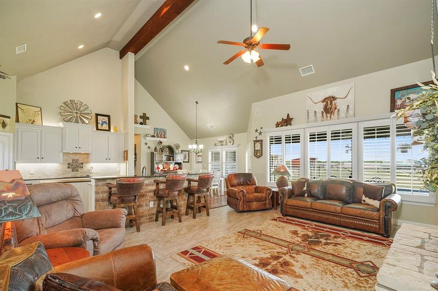 Use Preferred Lender to qualify for help with buyer’s closing costs, details in private remarks. Step into this magnificent 4-bedroom,3-bathroom home offering an impressive 2,847 sq ft of luxurious living space set on 2.13 picturesque acres Perfect for country enthusiasts alike this residence combines modern comfort with serene outdoor living. Enjoy the elegance of high ceilings with exposed beams and a striking white rock fireplace that soars to the cathedral ceiling in the living room, creating an inviting atmosphere for gatherings and relaxation. Experience culinary bliss in the beautifully updated kitchen featuring fresh white cabinetry with new hardware, new tile flooring, and generous counter space, making meal prep a breeze. Revel in the exquisite updates throughout including real hardwood floors in the entry hall, kitchen, dining area, and hallways. The spacious laundry room boasts a new granite countertop and sink, adding functionality to your daily routine. With a versatile upstairs game room and a dedicated office at the front, this home is designed for both work and play. Plus ,enjoy the built-in speaker system in the living area for your entertainment needs! The expansive backyard is your personal oasis, featuring a cozy fire pit, beautiful tree landscaping, and plenty of space for outdoor activities. Whether hosting friends or enjoying quiet evenings, this yard is a perfect retreat For horse lovers, the property includes a horse shed with hay storage, fenced areas for your animals, and a large shop with electricity for all your projects. A lean-to behind the shop provides additional storage and shelter options. Recent upgrades include a new AC unit, a new well house with sliding door access, and plantation shutters throughout, ensuring comfort and style year-round. Don’t Miss Out! This home is truly a rare find, offering a unique blend of modern amenities and tranquil country living. Schedule your private tour today!