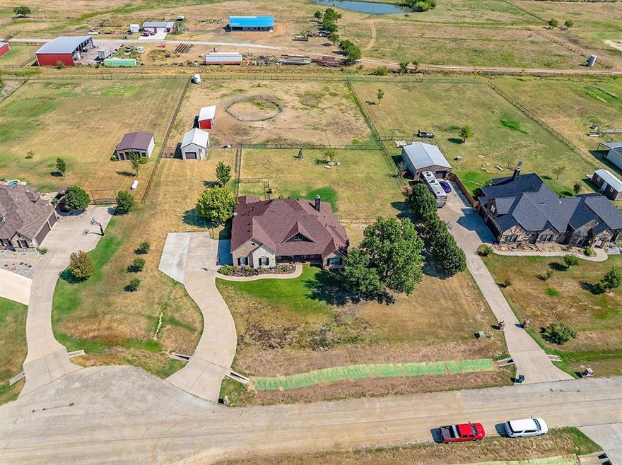 Use Preferred Lender to qualify for help with buyer’s closing costs, details in private remarks. Step into this magnificent 4-bedroom,3-bathroom home offering an impressive 2,847 sq ft of luxurious living space set on 2.13 picturesque acres Perfect for country enthusiasts alike this residence combines modern comfort with serene outdoor living. Enjoy the elegance of high ceilings with exposed beams and a striking white rock fireplace that soars to the cathedral ceiling in the living room, creating an inviting atmosphere for gatherings and relaxation. Experience culinary bliss in the beautifully updated kitchen featuring fresh white cabinetry with new hardware, new tile flooring, and generous counter space, making meal prep a breeze. Revel in the exquisite updates throughout including real hardwood floors in the entry hall, kitchen, dining area, and hallways. The spacious laundry room boasts a new granite countertop and sink, adding functionality to your daily routine. With a versatile upstairs game room and a dedicated office at the front, this home is designed for both work and play. Plus ,enjoy the built-in speaker system in the living area for your entertainment needs! The expansive backyard is your personal oasis, featuring a cozy fire pit, beautiful tree landscaping, and plenty of space for outdoor activities. Whether hosting friends or enjoying quiet evenings, this yard is a perfect retreat For horse lovers, the property includes a horse shed with hay storage, fenced areas for your animals, and a large shop with electricity for all your projects. A lean-to behind the shop provides additional storage and shelter options. Recent upgrades include a new AC unit, a new well house with sliding door access, and plantation shutters throughout, ensuring comfort and style year-round. Don’t Miss Out! This home is truly a rare find, offering a unique blend of modern amenities and tranquil country living. Schedule your private tour today!