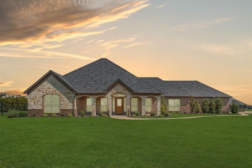 Nestled in the highly sought-after Winners Circle subdivision in Talty, this exceptional 4-bedroom, 3-bath residence sits on just over an acre within a gated community, offering the perfect balance of privacy and convenience. Immediate access to Interstate 20, commuting to Dallas and surrounding areas is effortless.
From the moment you step inside, you’re welcomed by an expansive open-concept design filled with natural light and refined, high-end finishes throughout. The thoughtfully designed kitchen flows seamlessly into the living and dining areas, creating an inviting space ideal for both everyday living and entertaining. A convenient mudroom just off the breakfast nook adds functionality for busy households.
The luxurious primary suite serves as a private retreat, complete with a spacious walk-in closet and spa-like comfort. Three additional generously sized bedrooms provide ample space for family and guests alike. Step outside to a wide, covered patio that extends your living space, while a three-car garage offers abundant storage and convenience.
Designed with comfort and efficiency in mind, the home features an advanced hot water circulation system that delivers instant hot water while optimizing energy usage.
The outdoor space is truly the showstopper. Set on a fully fenced, one-acre lot, this private oasis is built for entertaining and relaxation. Enjoy a state-of-the-art outdoor kitchen equipped with a Saber infrared grill, smoker, refrigerator, and drink cooler—perfect for hosting gatherings year-round. Unwind in the hot tub or watch your favorite games on the outdoor flat-screen TV, all enhanced by elegant JellyFish lighting that creates a stunning evening ambiance.
Additional features include a full sprinkler system to maintain lush landscaping, along with a Generac generator and a 500-gallon buried propane tank—ensuring comfort, security, and peace of mind no matter the season.