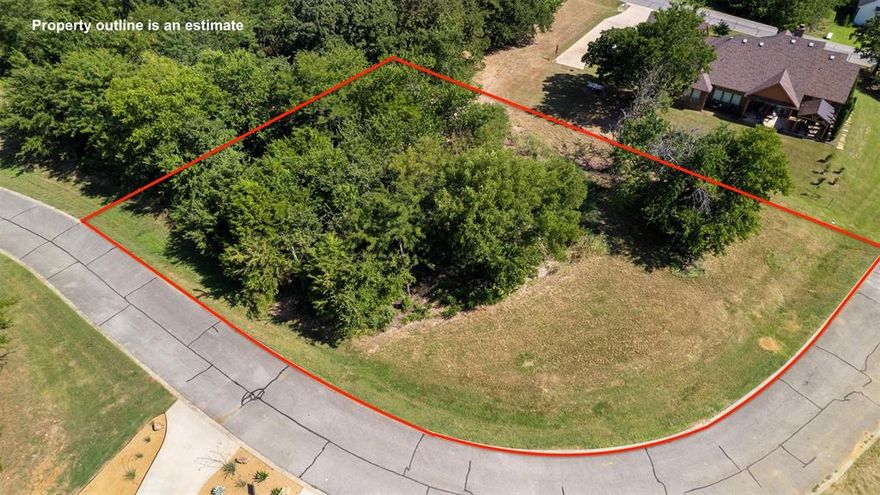 Rare Double Lot ...Welcome to the Beautiful Rock Creek Resort where you can build your dream home on this prime double corner lot in the Roaring Fork addition. Rock Creek Resort is located on Lake Texoma, a Master planned 1300 acre gated community that offers all the Luxury Amenities ideal for 2nd home or year round living. Appx 1 hr N of Dallas. Property ownership comes with privileges: Golf Club Membership at a Jack Nicklaus Designed Golf Course, Pool, Tennis, Hiking & Biking trails, Basketball, Guest Villa Suites (fee per night), Fitness Facilities, Club House, Restaurant, Pro Shop, Marina, Fishing & Boating. Enjoy all this before breaking ground. Golf membership conveys & golf dues of $106.25 per mo incl 6 rounds. Ideal building site! No time limit to build & you can choose your own architect & builder. A round of golf in the day, fish & boat for the rest of your play. Co-owner is a licensed agent.