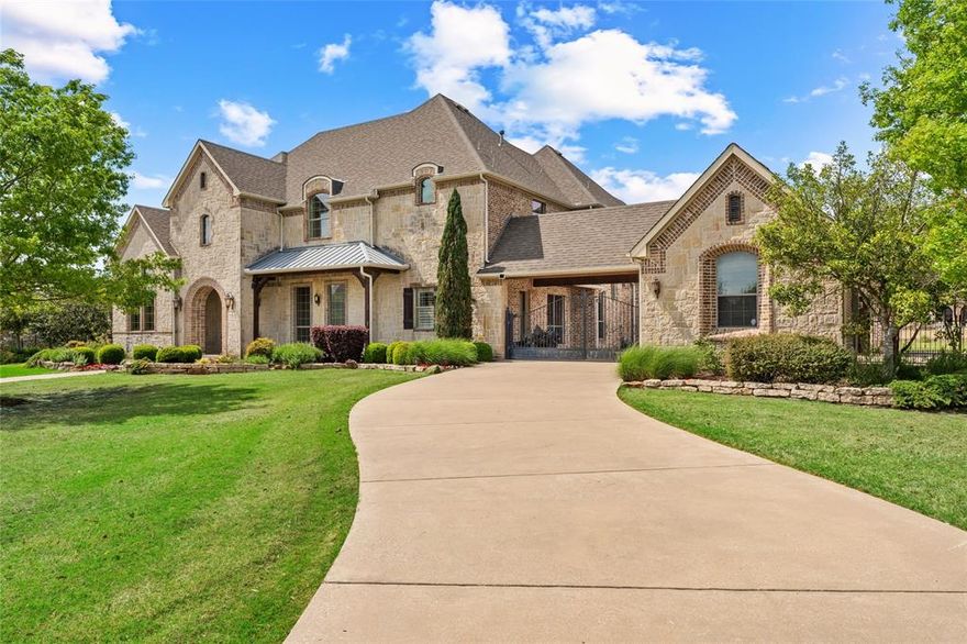 Incredible Deal in Rockwall!  Less than 30 minutes from Dallas, nestled within one of Rockwall County’s most prestigious gated enclaves, this stunning Old World inspired estate offers nearly 6,000 AC ft. of timeless elegance and luxury. The exterior enchants with authentic European design and  character. A grand entry welcomes defined by exceptional architectural detail, featuring vaulted ceilings and hand-distressed hardwood floors that blend classic charm with thoughtful craftsmanship. At the heart of the home, the chef’s kitchen is designed to impress with an expansive eat-in island accommodating  seating for eight, rich alder cabinetry, commercial grade appliances, nugget ice machine, revers osmosis system, and generous stone countertops. Arched openings create a seamless flow into the spacious living area, highlighted by a fireplace and views of the resort style pool. The main level primary suite offers a private retreat, featuring a spa inspired ensuite bath, dual vanities, a walk-in shower with rain head, and an oversized custom closet with extra cedar closet. The first floor also includes an elegant formal dining room, a dedicated study with custom built-ins, and large guest suite. Upstairs, you’ll find two generously sized bedrooms, a large game room, and a true home theater with Dolby Atmos sound system, perfect for entertainment and relaxation. Step outside to your private outdoor oasis, thoughtfully designed for year round enjoyment. The fully equipped outdoor kitchen includes a sink, refrigerator, Lynx grill, and Green Egg, while the heated pool and spa with water feature create a resort style ambiance ideal for entertaining. Completing the property is a stately four-car garage, accessed via a gated porte-cochere, combining functionality with architectural elegance, and a whole home water softener. Conveniently located less than 10 minutes from Lake Ray Hubbard and historic downtown Rockwall. Rockwall ISD - Rockwall-Heath High School. Low city taxes.