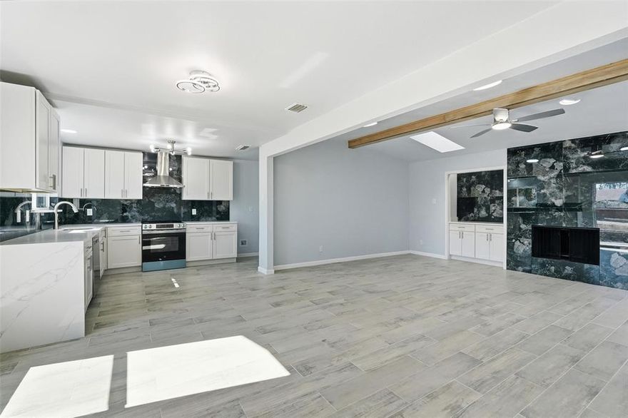 Located in the highly desirable North Garland subdivision, this stunning home has been completely transformed with over $100K in upgrades! Featuring 4 spacious bedrooms, an entertainment room, and 2 fully remodeled bathrooms, this property is a must-see. Step inside to a very open floor plan with a modern layout, a dream come true for most buyers. The large living room and dining area are both charming and inviting, with plenty of natural light pouring in through all-new windows. The entertainment room leads out to the sunroom. Enjoy cooking in the beautifully updated kitchen, complete with soft-close cabinets, a striking accent wall, complementary backsplash, and brand-new stainless steel appliances. The kitchen also boasts a new, vented hood and studio dimming lights that highlight the stunning quartz countertops — an ideal space for entertaining. Throughout the home, you’ll find brand-new wood-like tile and laminate flooring, offering both beauty and durability. The bathrooms have been fully remodeled, including separate stand-up showers, custom soft-close vanities, and matching countertops. Relax in the newly remodeled sunroom or enjoy the fresh, modern lighting fixtures and new hardware throughout the home. The interior has been freshly painted, giving it a vibrant, welcoming atmosphere. Additional upgrades include a new front door, windows, bathtubs, toilets, and a new fence. The home also features a spacious family room with a beautiful fireplace and a 2-car garage. This beautifully renovated home is perfect for anyone looking for a move-in-ready property without the hassle. It won’t last long on the market — schedule your tour today!