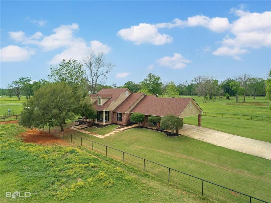 Motivated Sellers BRING ALL OFFERS!

Welcome to 2675 Swan Lake Rd where country living meets convenience in sought-after North Bossier. Situated on 11 beautifully maintained acres, this property offers the perfect blend of privacy, functionality, and proximity, just minutes from town and interstate access.

Designed with equestrian enthusiasts in mind, the fully fenced property features black pipe fencing, two round pens, two pastures, a pond, and two horse stables. Additional amenities include RV and tractor parking, multiple storage sheds, and a workshop with a detached bunkhouse mother-in-law suite. This space offers three additional bedrooms, a full kitchen, bathroom, laundry room, and built-in bunk beds, ideal for guests, rental potential, or extended family. A private electric gate and long gravel driveway lead to a spacious parking area and all outbuildings.

The main home boasts 4 bedrooms, 2 full bathrooms, and an additional exterior half bath. Inside, you’ll find an open concept layout with hardwood floors, fresh paint, plantation shutters, and decorative crown molding throughout. The living room features a wood burning fireplace and custom built ins, creating both style and functionality.

The kitchen is designed for everyday living and entertaining, offering quartz countertops, a subway tile backsplash, bar seating, and easy flow into both the formal dining area and an eat-in space.

The spacious primary suite includes a private ensuite bath with a soaking tub, separate shower, and a walk-in closet.

Enjoy mornings on the large covered front porch overlooking the front horse pasture, and unwind on the back porch with views of the rear pasture and pond where deer are often seen. Major updates include a newer roof, HVAC system, and water heater.

This exceptional property offers the best of both worlds space to spread out with close-to-town convenience.