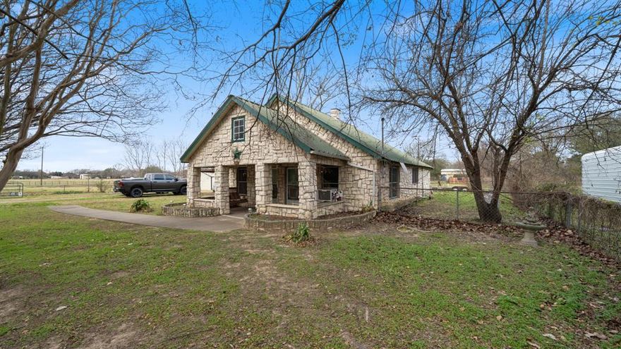 Step into the potential of this 1936 charmer, offering 1,230 square feet of living space on a generous 0.76-acre lot in the desirable Crandall ISD. This 3-bedroom, 1-bath home is ready for updates, making it an excellent opportunity for investors, DIY enthusiasts, or anyone looking to create a personalized country retreat. Enjoy peaceful mornings and evenings on the covered porches, perfect for relaxing or entertaining. The property includes a storage shed with electricity, ideal for tools or hobby space, plus two detached carports for convenient covered parking.
A standout feature is the two-bay shop, complete with a working car lift, offering a rare setup for mechanics, small business owners, or anyone needing a fully functional workshop. With its spacious lot, mature surroundings, and versatile outbuildings, this property delivers room to grow and endless possibilities for customization. A great chance to bring new life to a classic home with solid bones and exceptional potential. If Survey is needed then it will be at buyer's cost.