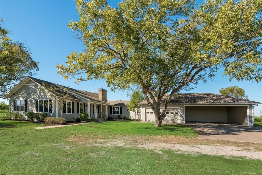 Rare find! 11.1 acre homestead with one family owning for the last 60 years. Fully upgraded house, massive workshop, and additional acreage to purchase. Country living at its best! This 3 bed-2 bath home has an open concept, great for family  gatherings and entertaining. Modern upgrades throughout with the desired farmhouse look-and-feel remaining. Electric gate entrance and the long tree-lined driveway adds desired privacy. Attached covered parking helps keep you and your vehicles protected in all weather. Insulated workshop with electricity and extra high draw doors add countless opportunities for your home-business projects, personal hobbies, and storage needs. Enjoy the sunset from the covered back porch right off the master bedroom. Approx 35 minutes to Dallas, you get the best of both worlds… space to roam with easy access to big city entertainment or work commute. Don’t miss the opportunity to make this country retreat your own!