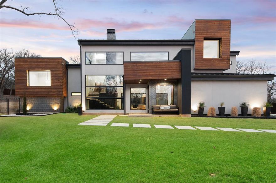 Breathtaking modern Custom Home sits on 4.79 acres in the heart of Argyle! This one of a kind home leaves nothing to be desired with designer details throughout. From the moment you walk in you are consumed by floor to ceiling windows in the open concept living space, the luxurious kitchen with oversized island and the  18 ft  sliding wall onto the covered patio and pool. Vaulted exposed beam ceilings accent the stained concrete floors throughout. A chef’s kitchen with marble counters and backsplash, mud room with dog wash, open wrap staircase, two story accent fireplace, a designer master oasis with walk through open shower, and a true two story MIL. Too many incredible features to list - simply a must see!