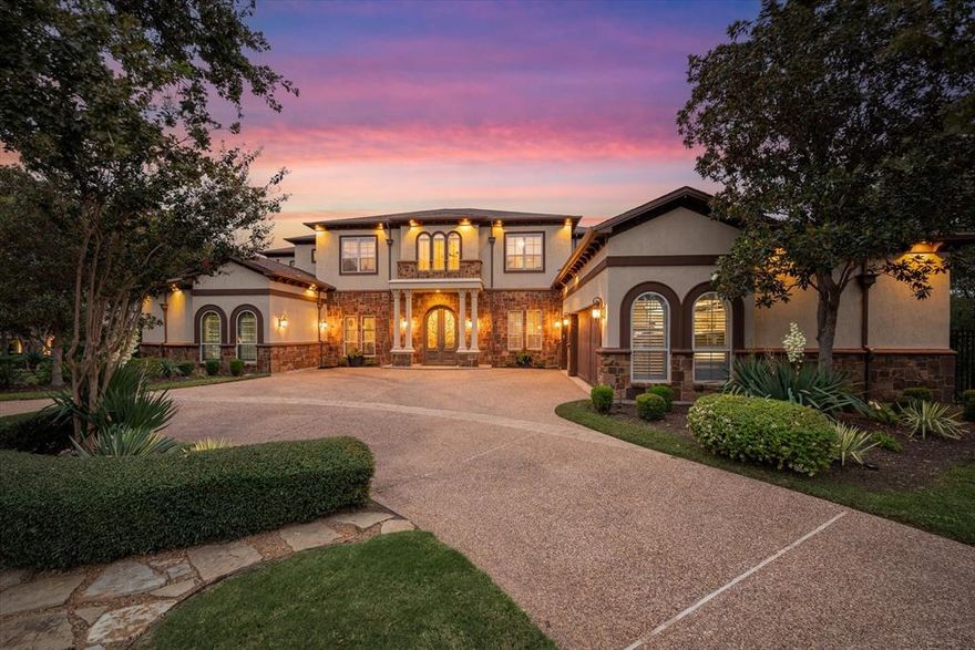 Nestled within the prestigious guard-gated community of Noble Point overlooking Grapevine Lake, this extraordinary estate redefines luxury living. Offering 7 bedrooms, 6 full baths, and 2 half baths, the home welcomes you with a grand entry showcasing dramatic double curved staircases and timeless elegance throughout. Formal living and dining rooms are designed for memorable entertaining, while the executive study with custom built-ins creates the perfect work-from-home retreat. Walls of windows frame picturesque views in the spacious family room, complete with balcony access for seamless indoor-outdoor living. The gourmet kitchen is a chef’s dream featuring a center island, dual sinks, dual dishwashers, gas cooktop, double ovens, pot filler, and built-in refrigerator. The private primary suite is a true sanctuary with its own sitting room and fireplace, plus a spa-inspired bath with soaking tub, oversized shower, and custom walk-in closet. An elevator provides convenient access to every level of the home.
The walkout basement is built for entertainment and relaxation with a tiered floor media room, expansive game room, exercise room with wet bar and sauna, a spacious guest suite and an additional bedroom. Upstairs, you’ll find 3 spacious bedrooms with walk-in closets along with a second game room overlooking the property.  What feels like a Hill Country resort is actually your own backyard, complete with sparkling heated pool and spa, fire pit, and full sport court for basketball and tennis. The covered patio with built-in grill is perfect for relaxing and entertaining. A charming detached casita offers a full kitchen, living room, bedroom, and bath—ideal for guests, extended family, or multigenerational living. Surrounded by mature shade trees and accented by balconies overlooking the treetops and lake, this is the lifestyle you’ve always imagined.