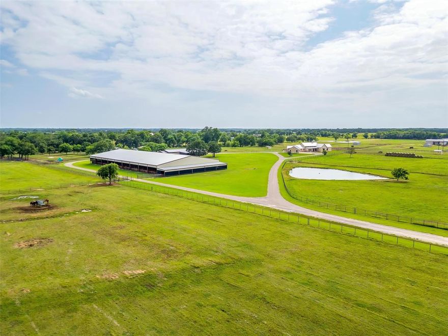 Welcome to Whispering Winds Ranch—a premier equestrian estate in Whitesboro, just an hour from Fort Worth. Spanning 68± acres of rolling pastures and mature oaks, this meticulously maintained ranch offers the ideal blend of luxury living and functional horse facilities. The heart of the property is a 5,000± SF custom ranch-style home, designed with timeless Texas charm. Inside, you'll find soaring beamed ceilings, stone accents, and an open-concept layout with 5 bedrooms, 6.5 baths, and multiple living areas. The expansive covered patio overlooks a resort-style pool with rock waterfalls and a fire pit, creating the perfect backdrop for entertaining or relaxing under the stars.

Tucked behind the arena, separate guest quarters offer a private and convenient space for visitors, full-time help, or traveling clients. The equestrian infrastructure is second to none. The main show barn includes 10 well-ventilated stalls with individual covered runs, automatic waterers, feeders, and drop-down grills. A custom tack room, two hot & cold wash racks, roll-up doors, laundry, and a bathroom complete the setup.

The 140’x250’ covered arena features LED lighting, two Big Ass Fans, and ample room for any discipline—whether you’re roping, working cattle, or jumping. Additional barns add more stall space and storage, while a 3-stall shed row barn includes water and tack storage with a roll-up door. The original barn includes 4 oversized stalls, breeding stocks, feed storage, and covered parking. Water and electric are thoughtfully routed throughout, and 8 cross-fenced turnouts ensure flexibility for rotation, rehab, or everyday use.

This turnkey property is a true Texas horseman’s haven—offering refined living and professional-grade equestrian amenities in one remarkable package.